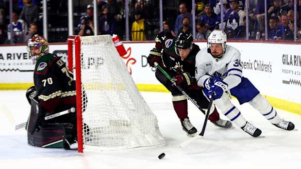 Auston Matthews skates behind the net